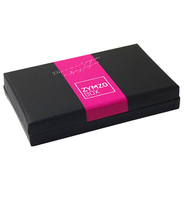 Cosmetici neri e contenitore d'imballaggio di regalo di carta rosa per le bottiglie cosmetiche